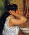 woman combing her hair Pierre Auguste Renoir